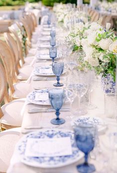 a long table set with blue and white china