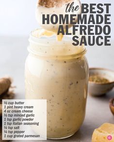 the best homemade alfredo sauce is in a jar with a spoon sticking out of it