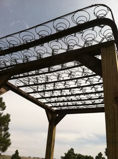 a wooden structure with lots of metal circles on it