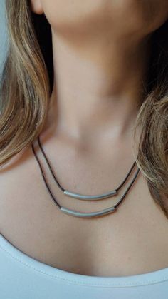 This minimalist necklace is ideal to wear every day, the beauty is in the simple things, thanks to its neutral colors it combines perfectly with any color. It also gives a boho style to any look. Combine it with other long necklaces Do not worry about allergies, this necklace is made with hypoallergenic materials, the thread is cotton and the metal of a zinc alloy, the closure is stainless steel. The measurements: long collar 36 and 38 cm. The tubes measure 7cm. Bring a 5 cm extender so you can Adjustable Minimalist Multi-strand Layered Necklace, Adjustable Long Layered Minimalist Necklace, Minimalist Long Adjustable Layered Necklace, Minimalist Adjustable Long Layered Necklace, Minimalist Adjustable Layered Necklace For Everyday, Minimalist Multi-strand Layered Necklace, Everyday Minimalist Multi-strand Layered Necklace, Minimalist Long Layered Necklace For Everyday, Minimalist Layered Necklace