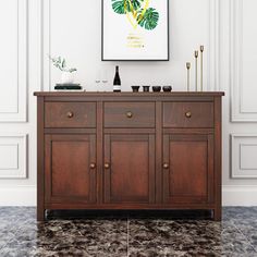 a large wooden cabinet in a room with white walls and marble flooring, along with an art print on the wall above it