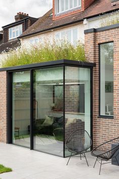 an outdoor patio area with chairs and tables