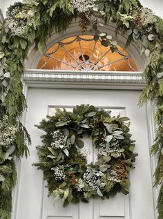 a wreath on the front door of a house