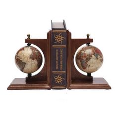 a bookend with two globes on top of it