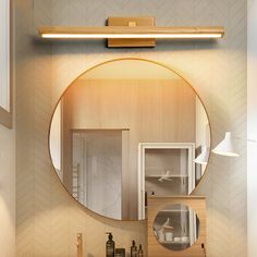 a bathroom with a round mirror on the wall