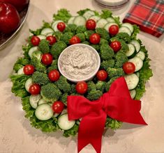 a platter filled with vegetables and dip