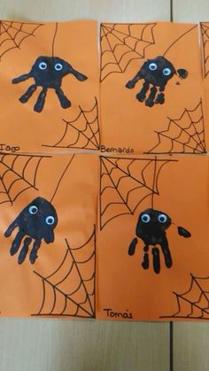 four pictures of handprinted hands and spider webs on orange paper with black eyes