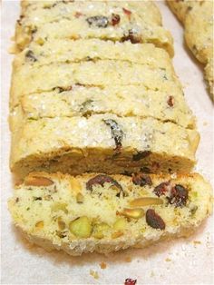 a loaf of fruit and nut bread cut in half