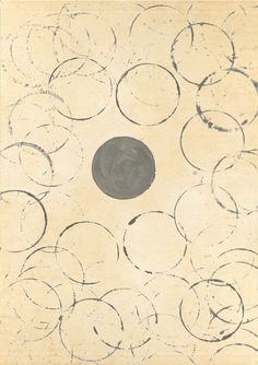 an abstract painting with circles and a black circle in the center on a beige background