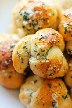 closeup of bread with herbs on it and cheese sprinkled over the top