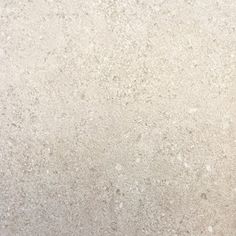 a close up view of a white marble surface