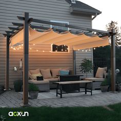 an outdoor living area with patio furniture and lights