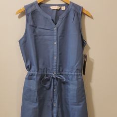 River Rose Sleeveless Dress. Drawstring Waist, Button Down. 65%Cotton 35%Lycol Casual Cotton Sleeveless Dress With Buttons, Sleeveless Denim Blue Dress With Buttons, Denim Blue Sleeveless Dress With Buttons, Casual Blue Sleeveless Dress With Buttons, Spring Sleeveless Denim Dress With Buttons, Blue Sleeveless Dress With Button Closure For Spring, Casual Sleeveless Buttoned Denim Dress, Rose Blue, Rose Dresses