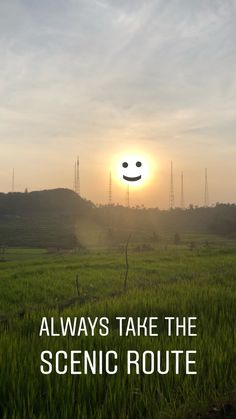 a field with the sun in the background and text that reads, always take the scenic route