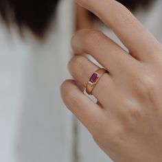 Make a bold statement with this exquisite Ruby Signet Ring, crafted in 14k solid gold. Featuring a stunning 6x4 mm emerald-shaped ruby, this ring exudes elegance and sophistication. The band starts at a width of 5 mm at the top and tapers gracefully to 2.30 mm at the bottom, ensuring both style and comfort. Material: 14-karat solid gold Gold Colors: Yellow, rose, white Ruby: 6x4 mm emerald-shaped ruby Band Width: 5 mm at top, tapering to 2.30 mm at bottom Ruby Signet Ring, Ruby Bands, Ringe Gold, Curved Wedding Band, Gold Diamond Rings, Signet Ring, Eternity Ring, Ring Verlobung, Ring Gift