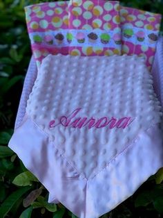 three diapers sitting on top of each other in the grass, with personalized ones