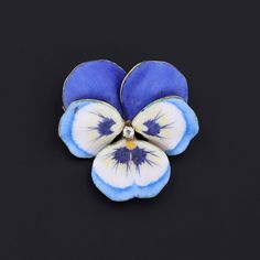 Pansies symbolize a hope that love should not be forgotten. This realistically rendered pansy brooch (circa 1910) features vibrant blue enamel with hand drawn veining and a glistening diamond accent at its center. The pansy is 14k gold and measures 1.3 inches from top to bottom by 1.25 inches wide. It is in excellent condition. We have many other fantastic offerings of period fine jewelry posted on our Etsy store, so please consider browsing our other items. We send all items in individually pac Vintage Turquoise Ring, Jewelry Post, Dragon Pendant, Vintage Turquoise, Vibrant Blue, Enamel Jewelry, Diamond Fashion, Antique Shops, Jewelry Rings Engagement