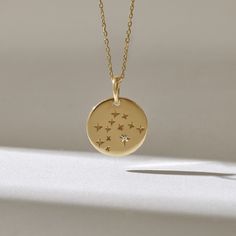 Minimalist design celestial necklace with stars for women Features * Made to Order. * Gold KT: 14KT * Custom Gold Color: Yellow Gold * Charm 14.82mm x 14.82mm * Charm Thickness: 0.75mm * Diamond Color-Clarity: D-E-F color VVS clarity (excellent ideal cut) * Total Ctw: 0.01 ctw * Ready to Ship in 5-7 Business Days ✓ We care about the environment,the jewelry we cast is made with recycled gold. We source exclusively post-consumer material that is refined back to their pure elements to ensure that t Celestial Round Necklace With Star Charm, Celestial Necklace With Star Charm, Celestial Star Charm Necklace, Dainty Necklace Layered, Celestial Necklace, Medallion Necklace, Jewellery Store, Diamond Star, Charm Pendant Necklace