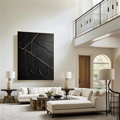 a living room filled with furniture and a painting on the wall