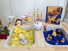 the beauty and the beast toys are on display in this playroom with other items