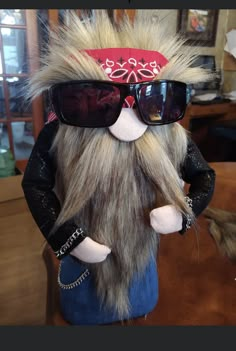 a stuffed animal with sunglasses on it's head