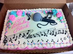 a sheet cake decorated with music notes and microphone