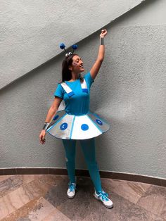 a woman in a blue and white costume