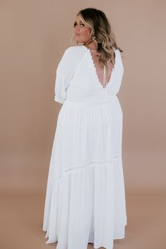 ECB Exclusive: Most Admired Maxi Dress in White. Crafted with meticulous attention to detail, this dress exudes elegance with its classic silhouette and flattering fit. The crisp white hue lends a touch of sophistication, while delicate lace detailing and intricate embroidery add a romantic and feminine allure. Perfect for a variety of occasions, it's sure to turn heads and leave a lasting impression wherever you go. Elevate your wardrobe with this timeless piece and make every moment unforgettable. Family photoshoot maxi dress Photoshoot dresses for moms Bride Casual Maxi Dress Neckline: Lace V Fabric: 100% polyester; Lining: 100% Polyester Cinched waistline Lined mid-length cuffed sleeve lace detailing adjustable tie back Fit: True to size, if in between we recommend sizing down before u White V-neck Maxi Dress With Lace Trim, Classic White Midi Dress For Brunch, Elegant Empire Waist Maxi Dress For Brunch, Elegant Flowy Maxi Dress With Lace Trim, White Formal Dress With Empire Waist, Elegant Flowy Dress With Lace Trim, White Fitted Empire Waist Maxi Dress, White Elegant Maxi Dress With Lace Trim, White Flowy Maxi Dress With Lace Trim