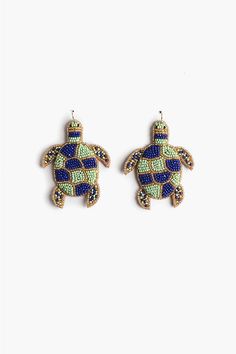 pair of sea turtle earrings with multicolored beadings on the back and sides