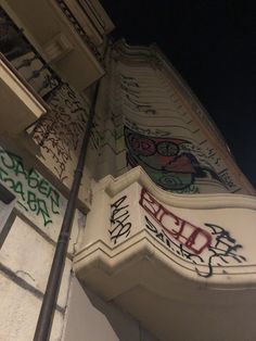 graffiti on the side of a building at night