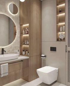 a bathroom with a toilet, sink and shelves on the wall next to each other