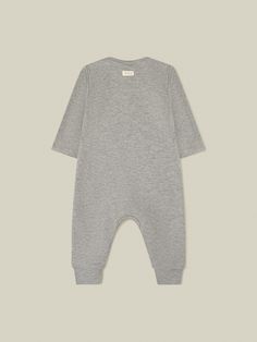 Minimal and intentional basics designed for every day! 100% ultra-soft organic cotton, 220 g. Our iconic Chocolate playsuit is a real wardrobe staple. Your favourite for almost ten years. Luxuriously soft to ensure comfortable days and nights. It features a Chocolate print, envelope crewneck and poppers around the legs for easy changing. Organic zoo clothes are unisex and are made to be mixed and matched. Designed in the UK. Made in Europe. To help you find the right size, please use the size ch Gray Cotton Jumpsuits And Rompers For Loungewear, Cotton Long Sleeve Onesie For Sleep, Solid Cotton Jumpsuits And Rompers For Loungewear, Cotton Loungewear Jumpsuits And Rompers, Cotton Bodysuit For Loungewear, Cotton Lounging Jumpsuits And Rompers In Solid Color, Relaxed Fit Cotton Bodysuit For Loungewear, Gray Cotton Onesie For Loungewear, Organic Cotton Fitted Bodysuit For Loungewear