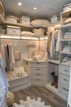 the closet is organized with all white items