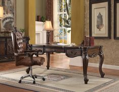 an antique desk and chair in a living room