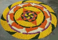 a colorful flower design is on the ground