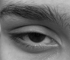 a man's eye is shown in black and white