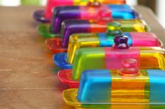 colorful plastic containers lined up on a table