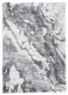 a gray and white rug with an abstract design