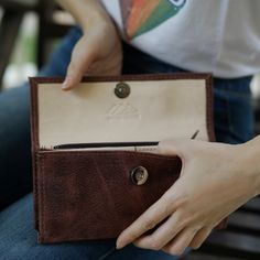 With so many ladies' wallets on the market, it's difficult to decide which one best fits your needs. We are here to help and believe we have some great options to consider. Our Handmade Brown Women’s Wallet is a comfortable way to carry your necessities. There are two bill compartments, 12 storage slots for cards and two open space compartments. The interior zipper pocket is perfect for those small items and loose change. Everything closes easily with a magnetic closure. Beyond its great appeara Leather Change Purse, Dslr Camera Straps, Leather Camera Strap, Lake Atitlan, Womens Wallet, Brown Leather Wallet, Loose Change, Handmade Leather Wallet, Leather Coin Purse