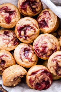 a basket filled with muffins sitting on top of a table