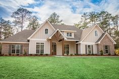 a large house with lots of windows in the front yard