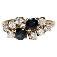 an antique diamond and sapphire cluster ring