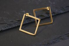 These 18k gold plated square earrings are great for casual or formal occasions such as weddings, graduations and birthday parties and would be an excellent gift for any jewellery lover. Your geometric earrings will come complete in a beautiful branded eco box ready for gifting. Size: 25 x 25mm We aim to dispatch all the orders on the same day so you can enjoy your jewellery without a long wait. Please visit our shop for more gold and silver jewellery. https://www.etsy.com/uk/shop/OnnanokoCo Elegant Rectangular Hoop Earrings For Formal Occasions, Classic Gold Square Cut Earrings, Modern Square Hoop Earrings Tarnish Resistant, Elegant Gold Plated Square Jewelry, Classic Square Yellow Gold Earrings, Modern Square Tarnish-resistant Hoop Earrings, Classic Square Earrings As Gift, Classic Square Earrings For Gift, Classic Square Earrings For Gifts