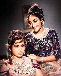 an old photo of two women in dresses