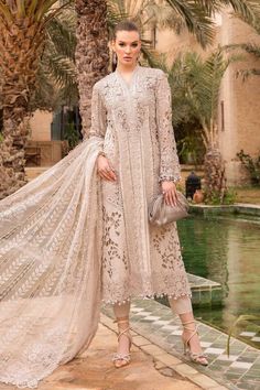 Brand: Maria.BProduct Code: D-2409-ACollection: Maria.B Unstitched Embroidered Luxury Lawn CollectionFabric: Lawn DESIGN DETAILS: ShirtEmbroidered Organza Neckline Patch With 3D Flowers & PearlsEmbroidered Lawn Neck PattiDobby Lawn Center Front With 3D LaceEmbroidered Lawn Side PanelsDobby Lawn Back & SleevesEmbroidered Lace For SleevesEmbroidered Sleeves PatchEmbroidered Organza Sleeves & Side Panel PatchesEmbroidered Organza Ghera & Sleeves Patti With 3D Flowers DupattaPoly Organza Burnout Dupatta TrousersDyed Cambric TrouserColor: Ivory CARE INSTRUCTIONS: Extra Fabric Has Been Used For Shoot Original Color May Vary Slightly From The Picture Dry Clean Recommended Iron The Clothes At Moderate Temperature Do Not Use Bleach, Or Stain Removing Chemicals Damp Fabric Should Not Be Exposed To S Embroidered Sleeves