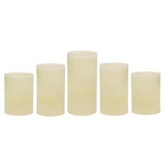 four candles are lined up on a white background