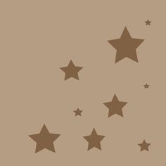 stars are flying in the air on a brown background