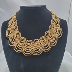 Signature Gold Braided Seed Bead Statement Necklace Gold Tone Claw Closure Gold Tone End Cap 1.5 Inch Width 17 Inch With 3 Inch Extender Elegant Adjustable Bib Necklace With Beaded Chain, Elegant Adjustable Beaded Chain Bib Necklaces, Elegant Gold Choker With Colorful Beads, Elegant Gold Choker With Faceted Beads, Adjustable Gold Bib Necklace With Beads, Gold Bib Necklace With Large Beads For Jewelry Making, Elegant Adjustable Bib Necklaces With Round Beads, Elegant Adjustable Bib Necklace With Round Beads, Gold Choker With Large Beads As Gift