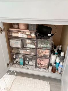 an open cabinet filled with lots of beauty products