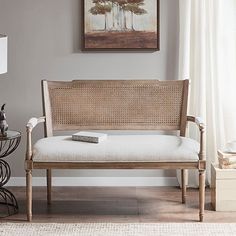 a living room filled with furniture and a painting on the wall above it's headboard